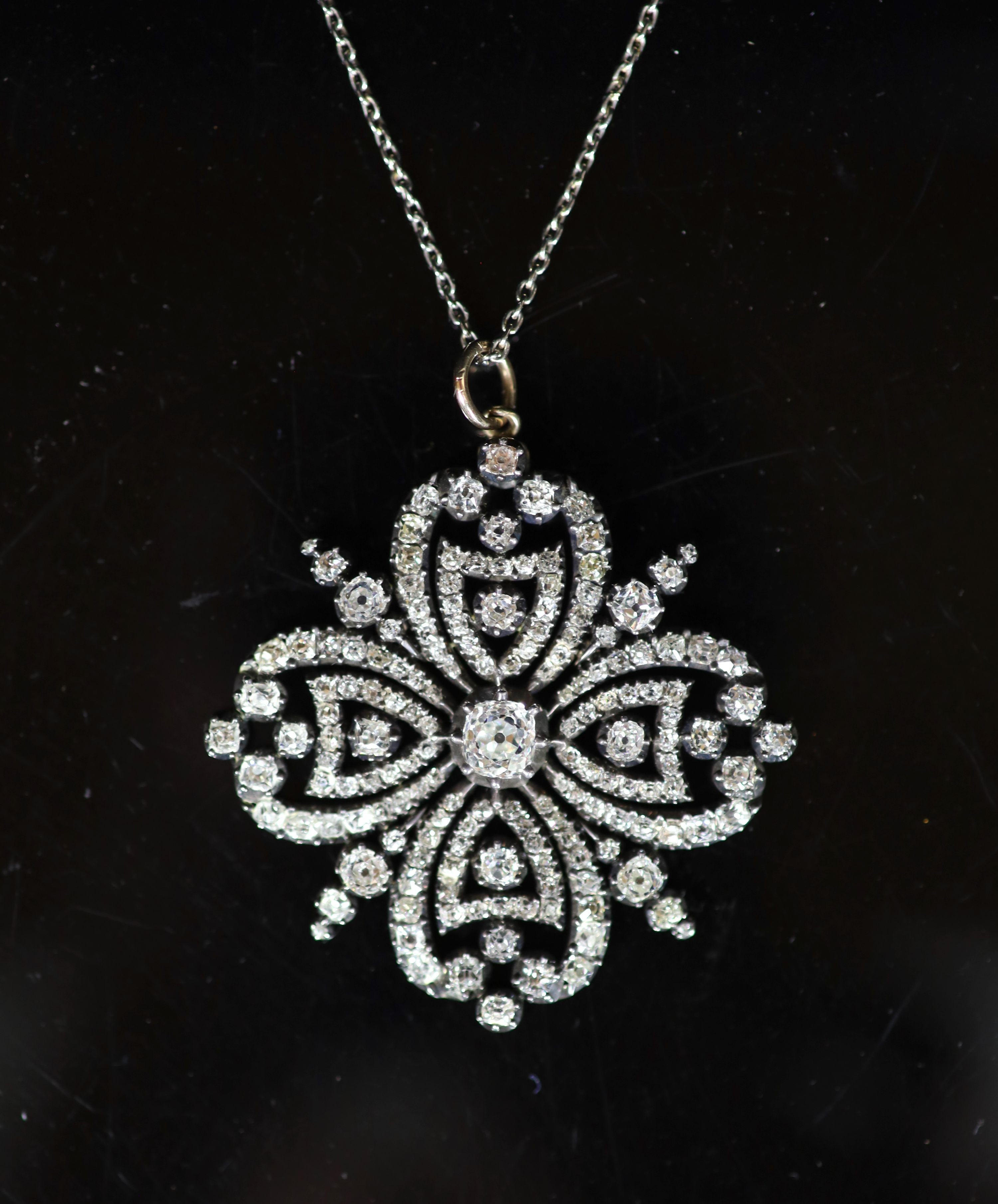 A good Victorian gold, silver and diamond set open work pendant